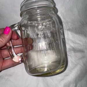 Clear Glass Mason Jar with Handle “You Are My Sunshine” is engraved on the front